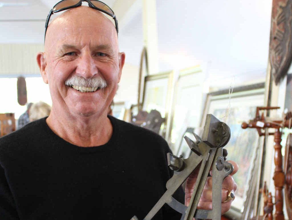 NAUTICAL APPRECIATION: Gulmarrad resident Paul Wheeler checks out a 19th century sextant, which was one of more than 300 items auctioned at the Harwood Hall yesterday. Photo Clair Morton NAUTICAL APPRECIATION: Gulmarrad resident Paul Wheeler checks out a 19th century sextant, which was one of more than 300 items auctioned at the Harwood Hall yesterday. Photo Clair Morton